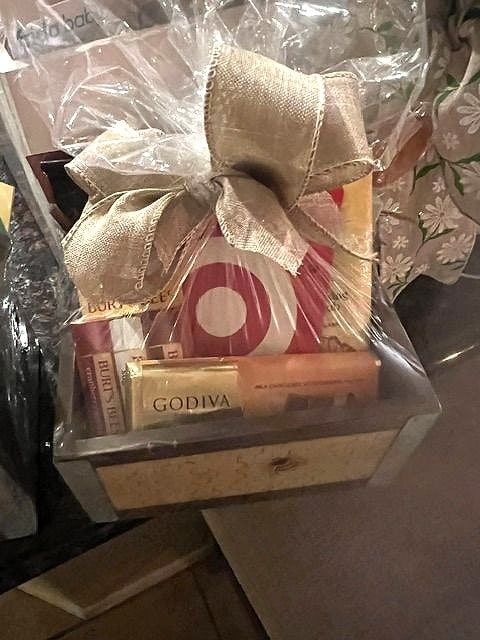 Wooden crate with Godiva chocolates and treats under a burlap bow