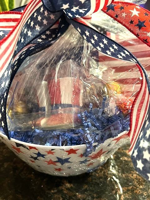 Star-print bowl with patriotic treats and a stars-and-stripes ribbon bow